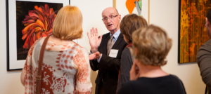 Staff discussing to three people