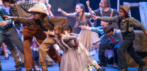 Children and young adults performing on stage